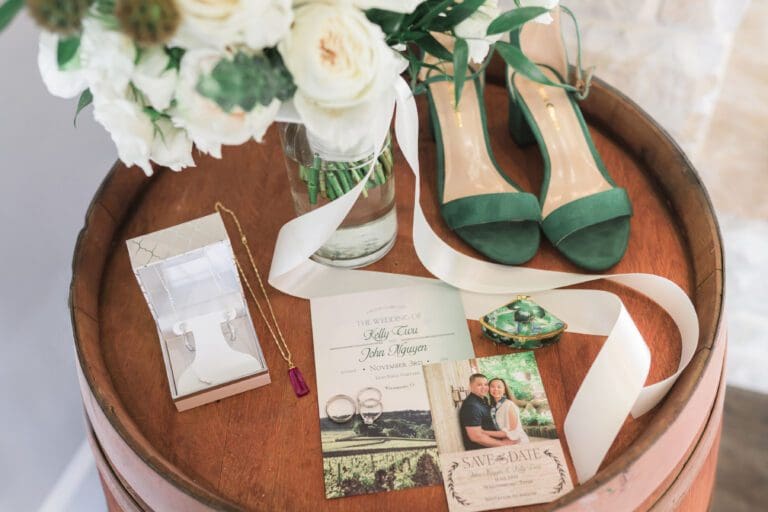 a bouquet of flowers and shoes on a table. Photo-Retouching by Bushel + Peck Photo