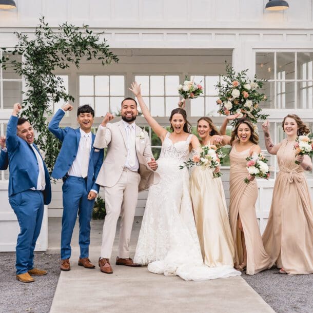a group of people posing for a photo by Bushel + Peck Photo, Texas Wedding Photographers