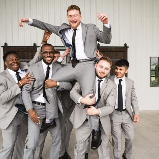 a group of men in suits. Photo by Bushel + Peck Photo, Texas Wedding Photographers