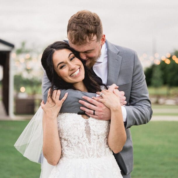a man and woman hugging. Wedding-Photography
