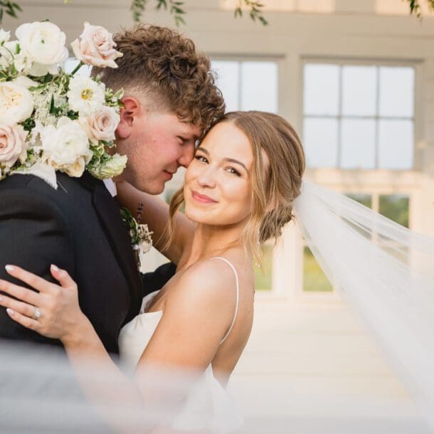 a man and woman hugging each other. photo by Bushel + Peck Photo, Texas Wedding Photographers.