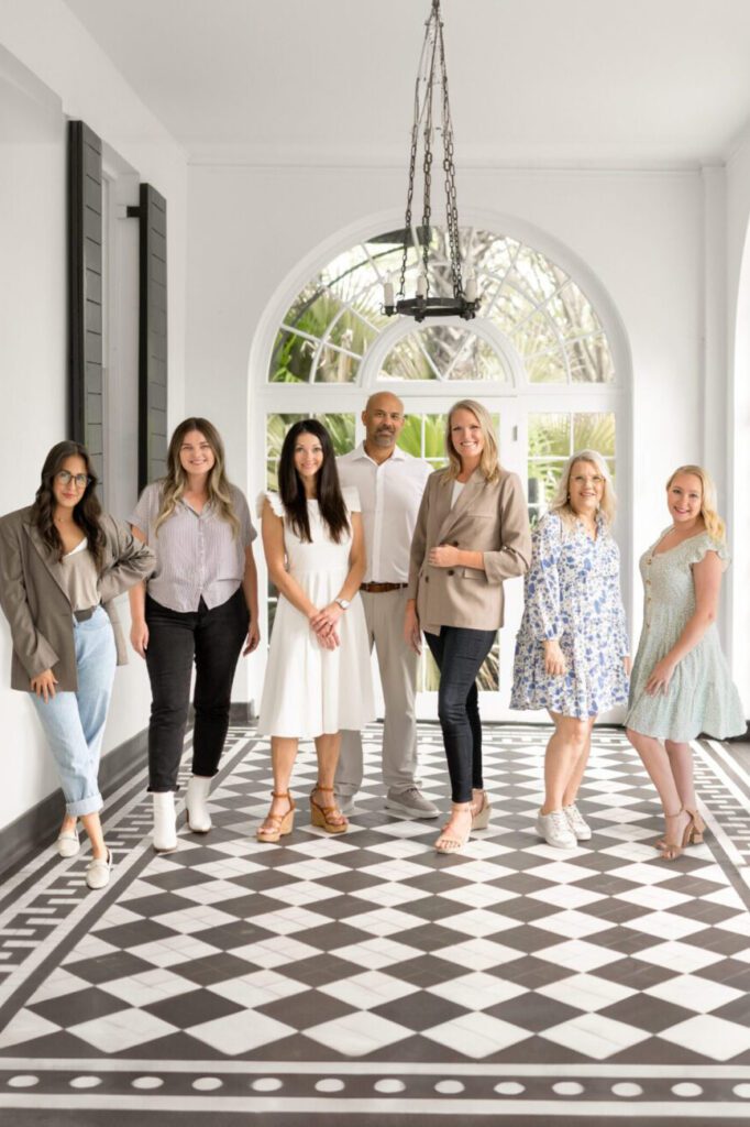Bushel + Peck Photo team posing in a bright, elegant space — award-winning wedding photographers.
