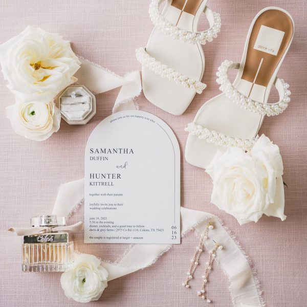 a white sandals with pearls and flowers. Photo by Bushel + Peck Photo, Texas Wedding Photographers